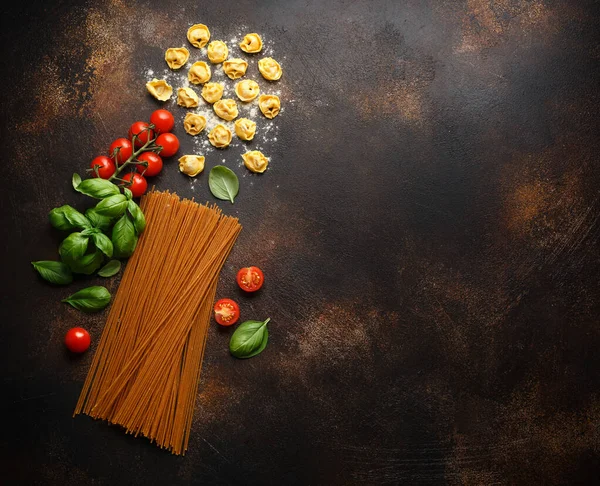 stock image Italian healthy food ingredients ready for cooking. Ravioli, spaghetti, cherry tomatoes, basil