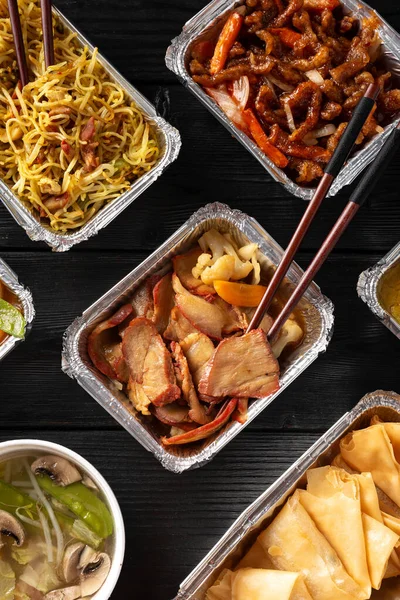 Chinese takeaway food. Kung Po king prawns, crispy won ton, roast pork char siu, prawn curry, shredded beef, soup