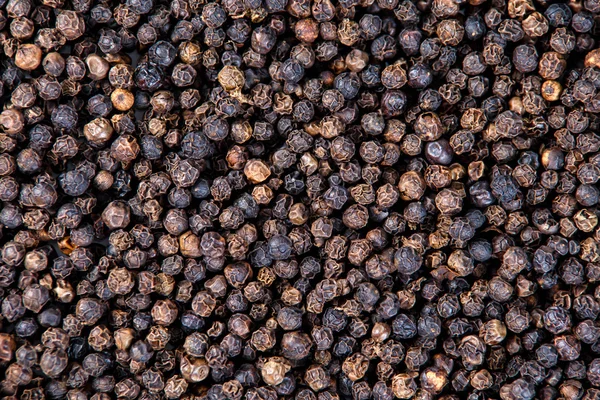 Zwarte peper, droge Peppercorn achtergrond, textuur Stockafbeelding