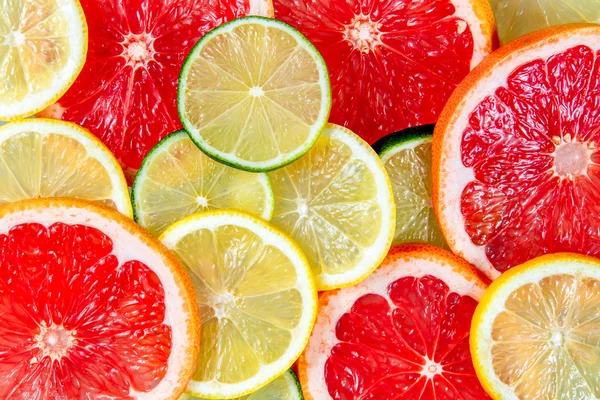 Fresh Grapefruit juicy slices. Rich witch vitamin C isolated on white background.