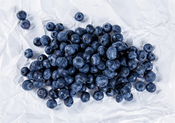 Fresh Juicy Blueberries on crumpled paper. Rich with vitamins. — Zdjęcie stockowe