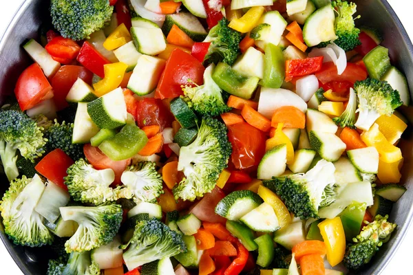 Ready to Cook Roasted Vegetables stewed Tomatoes, Carrots, Peppers, Courgettes, brocoli, onion on plates. Stockfoto