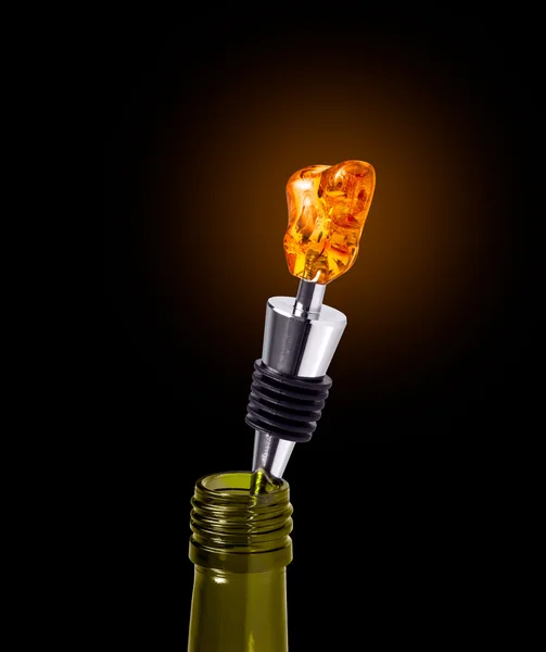 Bottle of Wine with a Stopper from Amber isolated on black background — Stock Photo, Image