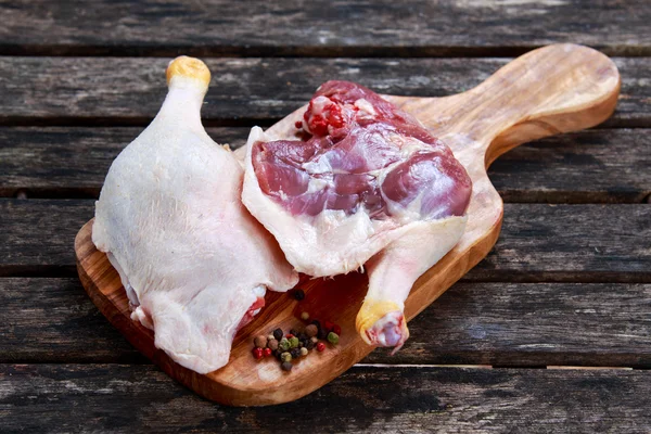 Free range Duck legs with herbs. on old wooden table. — Stock Photo, Image