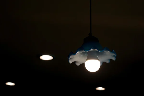 Fluorescent light bulb in hanging lamp — Stock Photo, Image