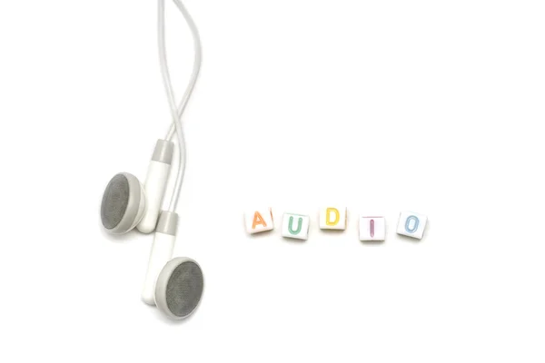 White earbuds with alphabet audio — Stock Photo, Image