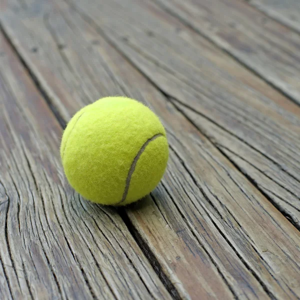 Tennis ball  on wooden background — Stock Photo, Image