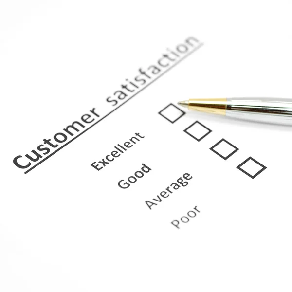 Customer satisfaction survey form with the pen — Stock Photo, Image