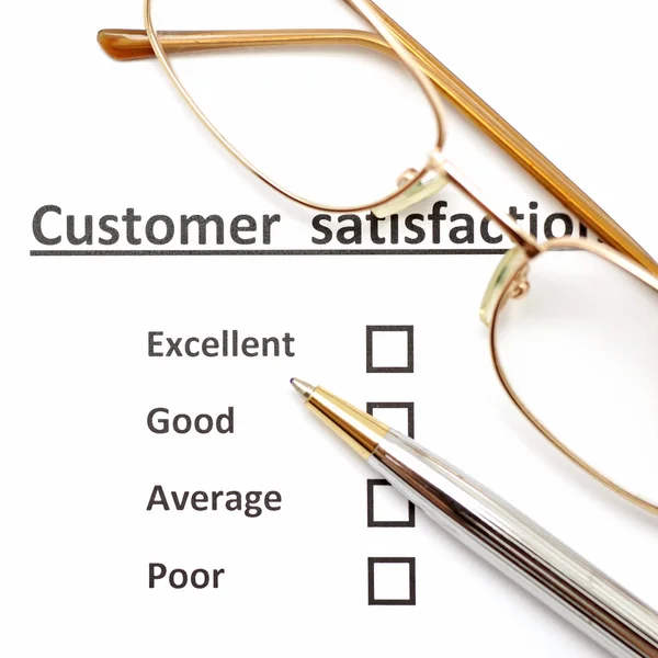 Customer satisfaction survey form with pen and eye glasses — Stock Photo, Image