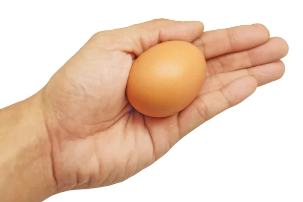 Jajko w ręku mężczyzna na białym tle — Zdjęcie stockowe
