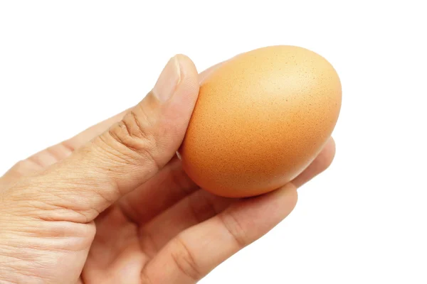 Jajko w ręku mężczyzna na białym tle — Zdjęcie stockowe