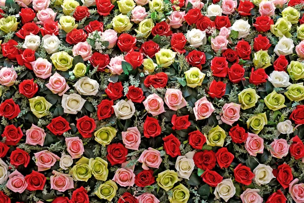 Růže umělá květina jako pozadí — Stock fotografie