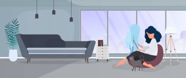 Kız bir sedirin üzerinde oturuyor ve dizüstü bilgisayarda çalışıyor. Dizüstü bilgisayarı olan bir kadın büyük bir puf üzerinde oturur. Kedi kızın bacağına sürtünüyor. Vektör.