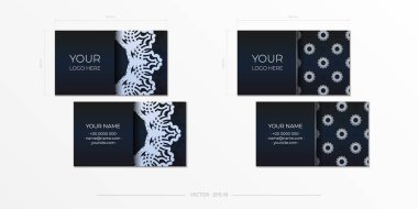 Koyu mavi kartvizitler. Dekoratif kartvizit süslemeleri, oryantal desenler, resimleme.