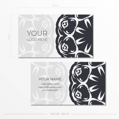 Beyaz kartvizitleri klasik kalıplarla hazırlıyorum. Monogram süslemeli baskı tasarım kartviziti şablonu.