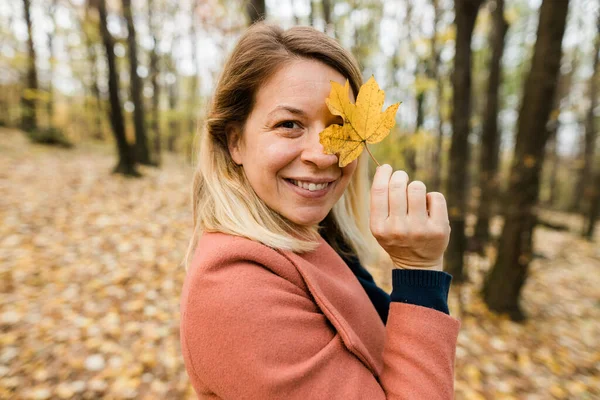 Young Woman Holding Yellow Autumn Leaves Forest Stock Photo