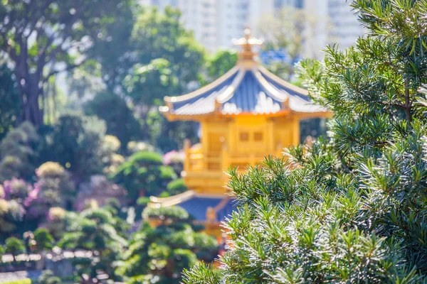 Golden temple in a garden — Stock Photo, Image