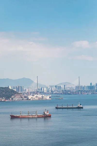 Empty Cargo container ship in Victoria Harbour, Hong Kong. Industrial Transportation