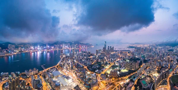 Epic aerial view of night scene of Victoria Harbour, Hong Kong, famous travel destination, metropolis