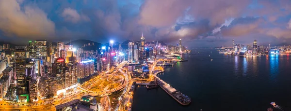 Epic aerial view of night scene of Victoria Harbour, Hong Kong, famous travel destination, metropolis
