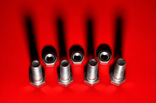 Metal Bolts Nuts Red Background Hardware — Stock Photo, Image