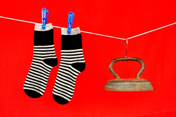 Socks Hanging Rope Old Iron Red Background — Stockfoto