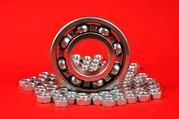 Bearing Metal Nuts Red Background Spare Parts — Stock Photo, Image