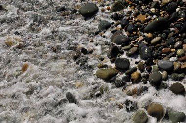 Deniz çakıl taşları yakın plan. Arkaplan resmi.