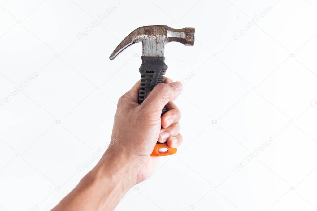 Top angle of young man left handed using hammer on white background