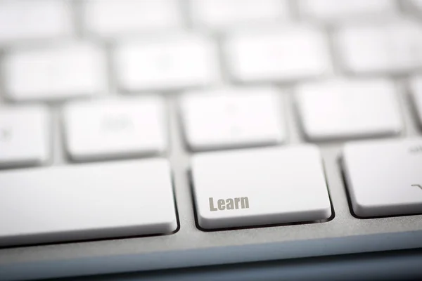 La palabra "APRENDER" escrita en el teclado — Foto de Stock