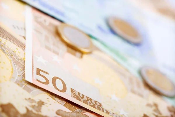 Closeup of euro banknotes and coins — Stock Photo, Image