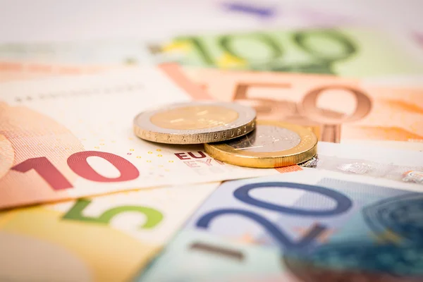 Closeup of banknotes and coins — Stock Photo, Image