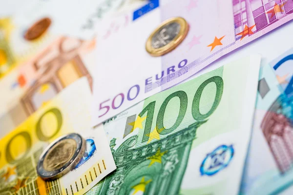 Closeup of banknotes and coins — Stock Photo, Image