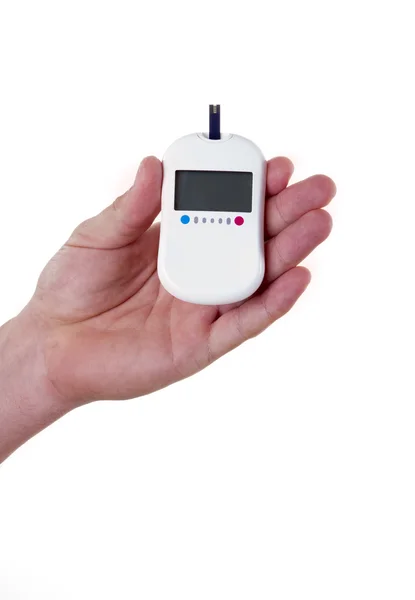 Glukometer i mans hand, isolerad på vit — Stockfoto