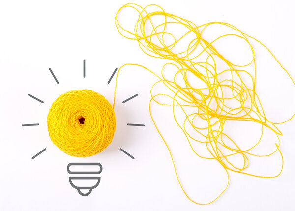 Inspiration concept yarn yellow light bulb
