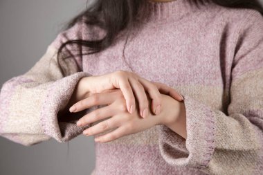 young sad woman hand ache hand