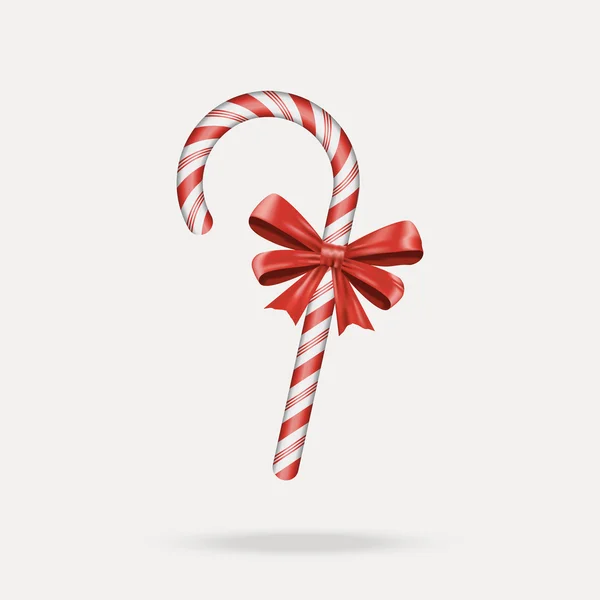 Cane de caramelo de Navidad con arco rojo — Vector de stock