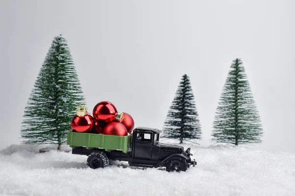 One Toy Car Rides Snow Back Red Christmas Balls — Stock Photo, Image