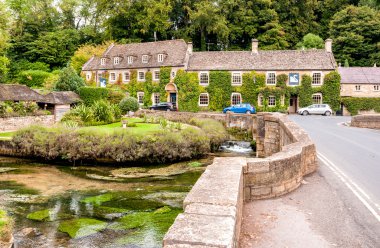 Country house hotel in the Cotswold village of Bibury clipart