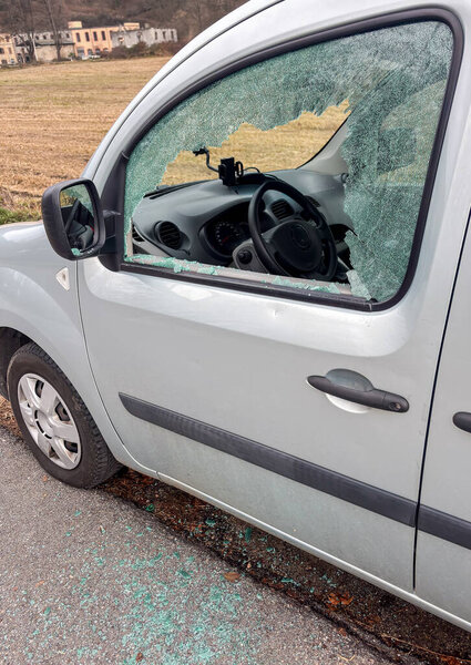 Car window smashed as a result of an act of vandalism