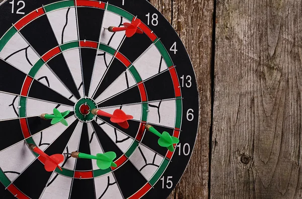 Darts on a wooden background — Stock Photo, Image