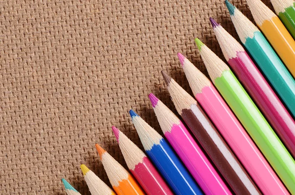 Color pencils on a board — Stock Photo, Image