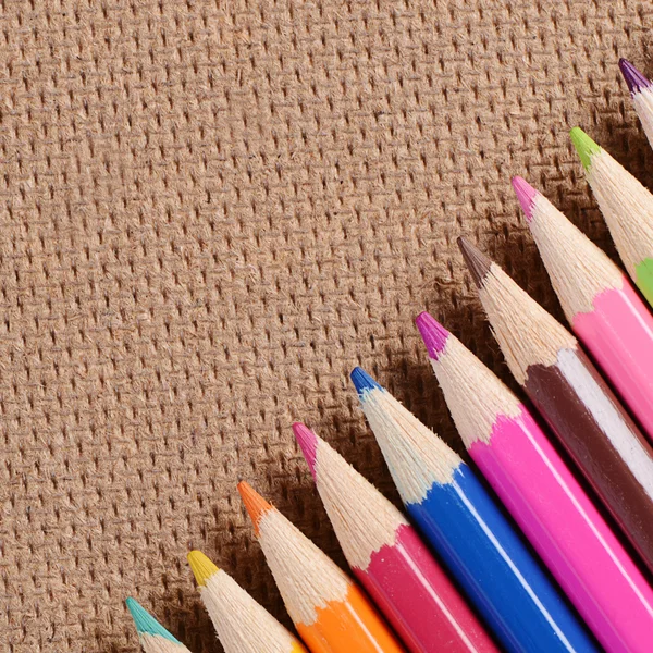 Color pencils on a board — Stock Photo, Image