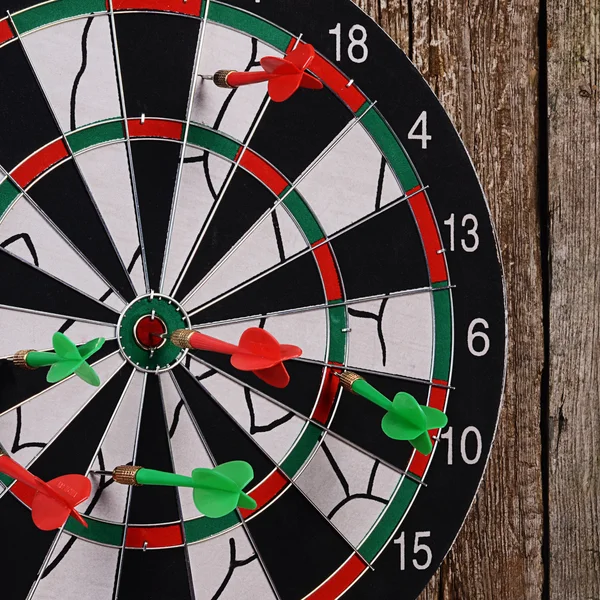 Darts on a wooden background — Stock Photo, Image