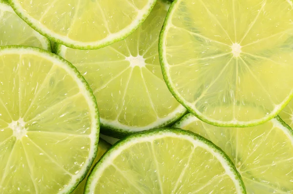 The fresh lime a background closeup — Stock Photo, Image
