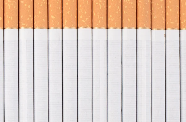 Fila de cigarrillos como fondo —  Fotos de Stock