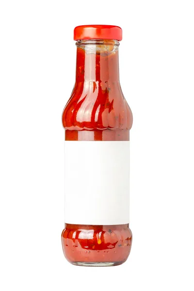 Botella de vidrio de salsa de tomate caliente sobre fondo blanco con espacio de copia Imágenes de stock libres de derechos