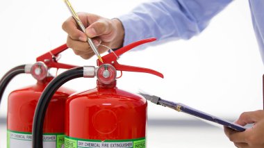 Fire protection engineering checking inspection services the red fire extinguishers tank in the building concepts of prevent emergency and safety rescue and fire training. clipart