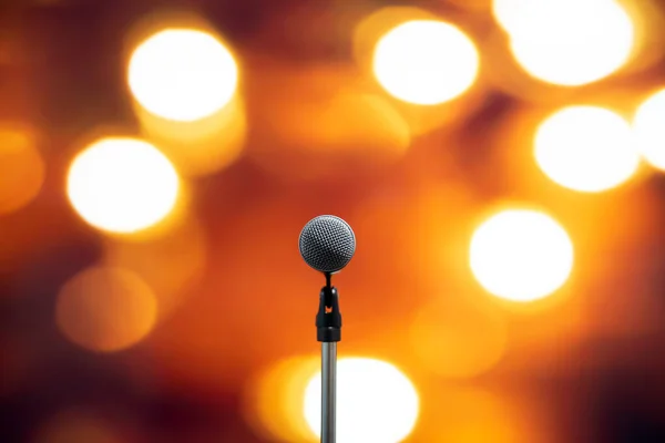 Public speaking backgrounds, Close-up the microphone on stand for speaker speech at seminar room with technology blur bokeh light background and.