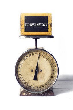 Prevention on an antique scale clipart